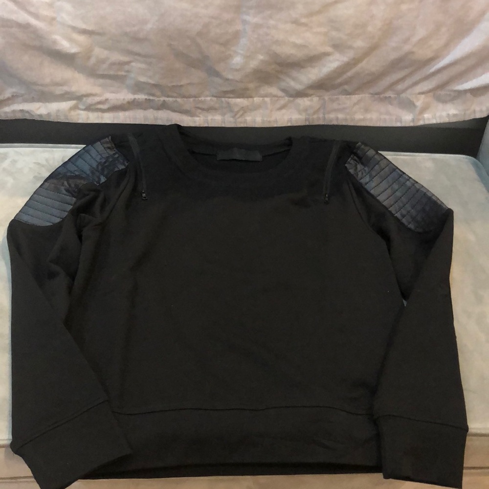 Black sweater with leather shoulder pads